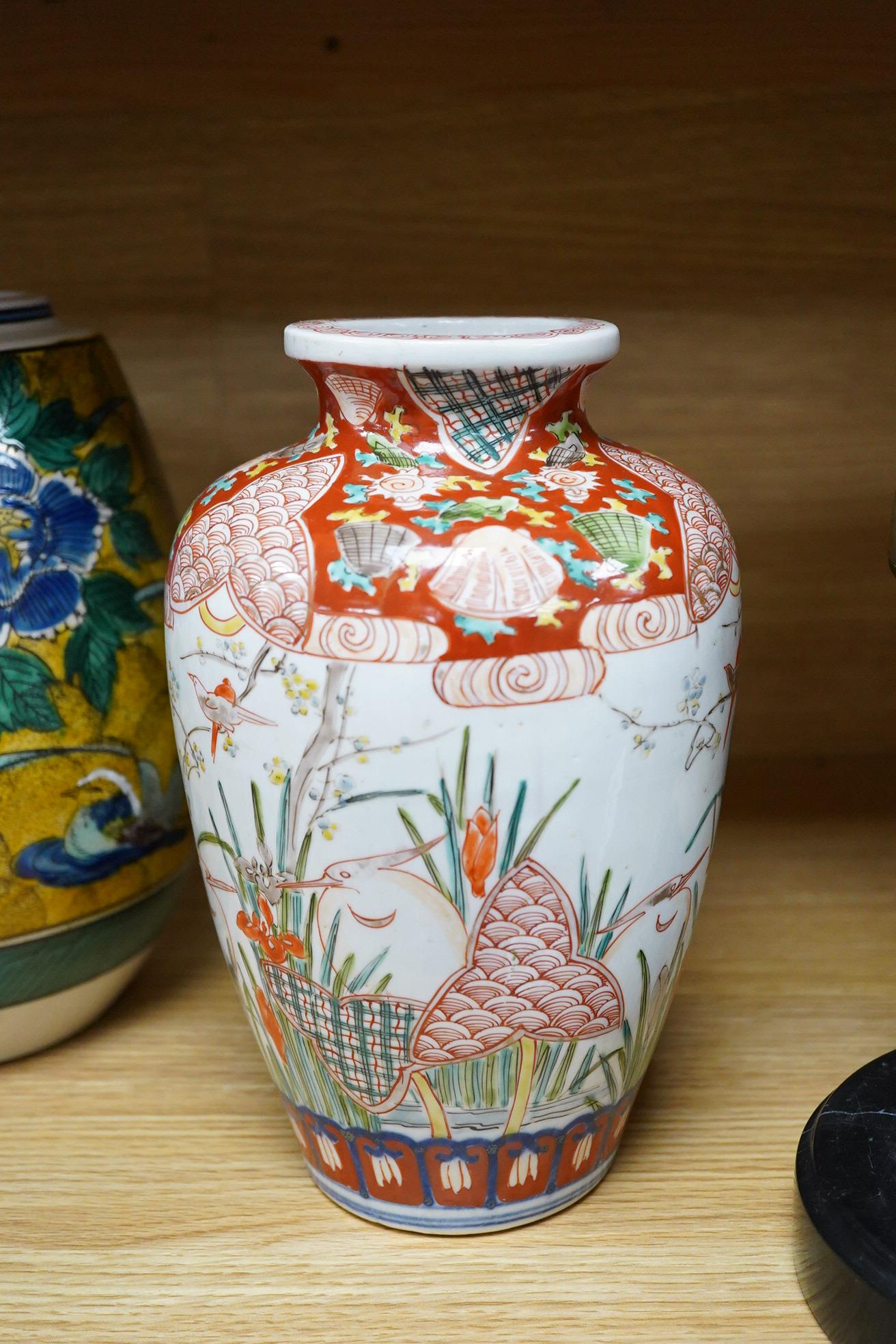 A Japanese green Kutani vase, a pair of Imari vases and smaller vase (4)
